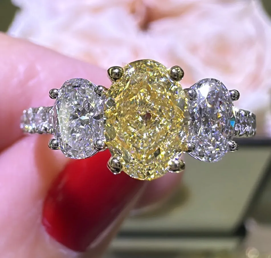 1.97ct tw Oval Canary Fancy Yellow Three Stone Diamond Ring