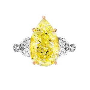 GIA Certified 3 Stone ring with 7.78ct Fancy Yellow Pear Shape Diamond