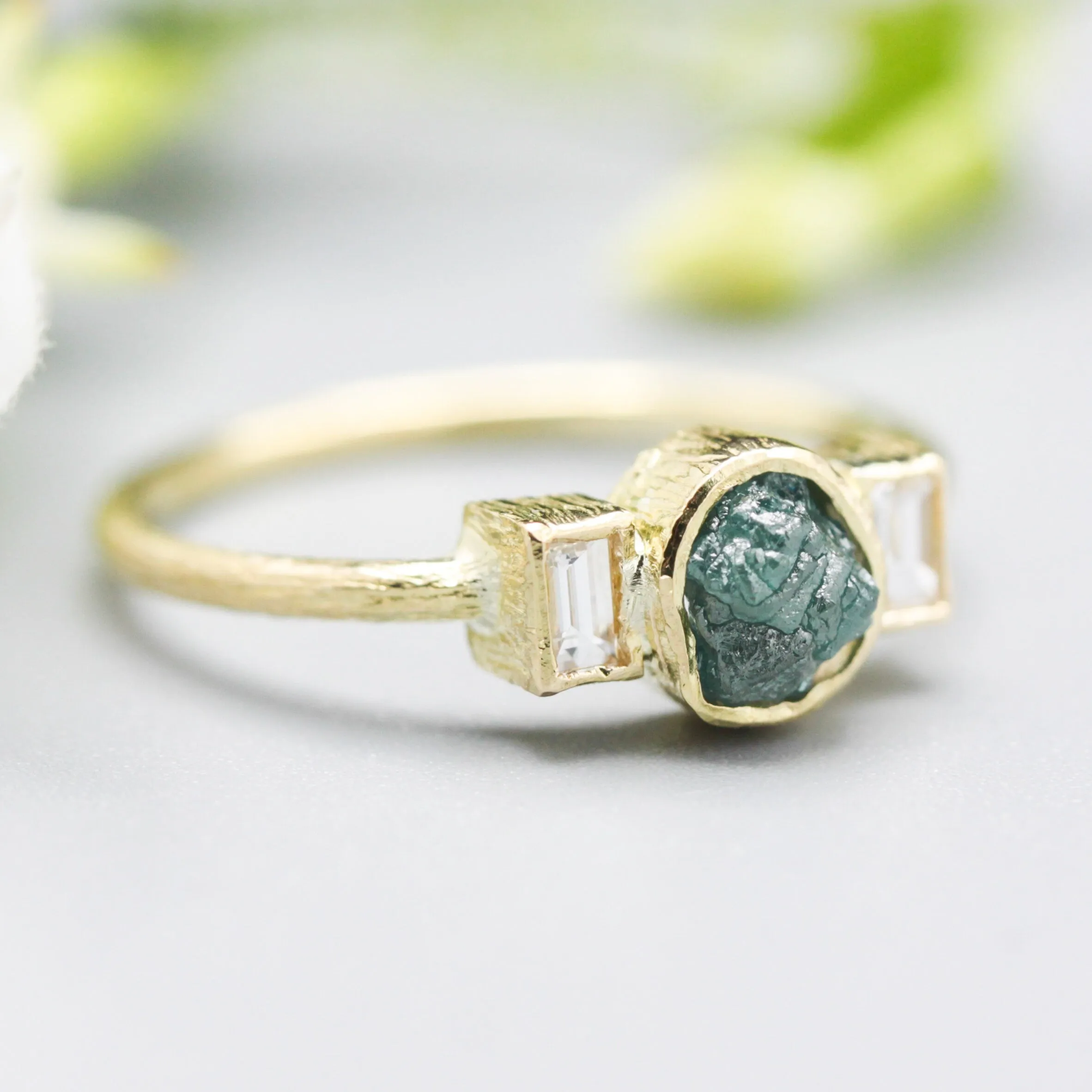 Rough diamond ring and twin side set diamonds with 18k gold texture band