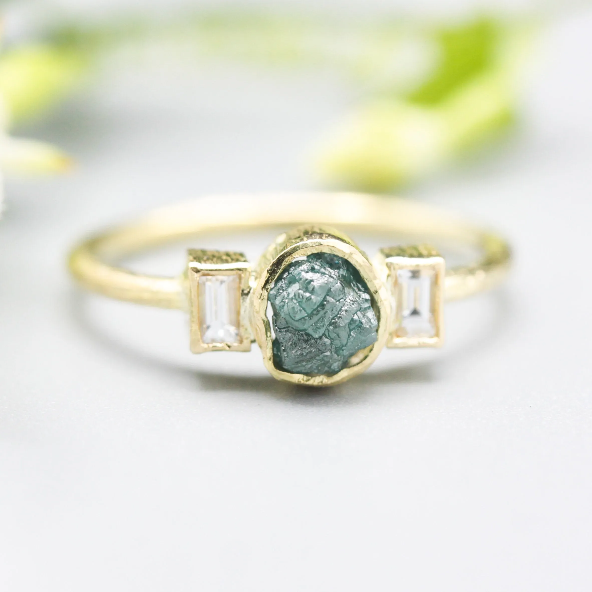 Rough diamond ring and twin side set diamonds with 18k gold texture band